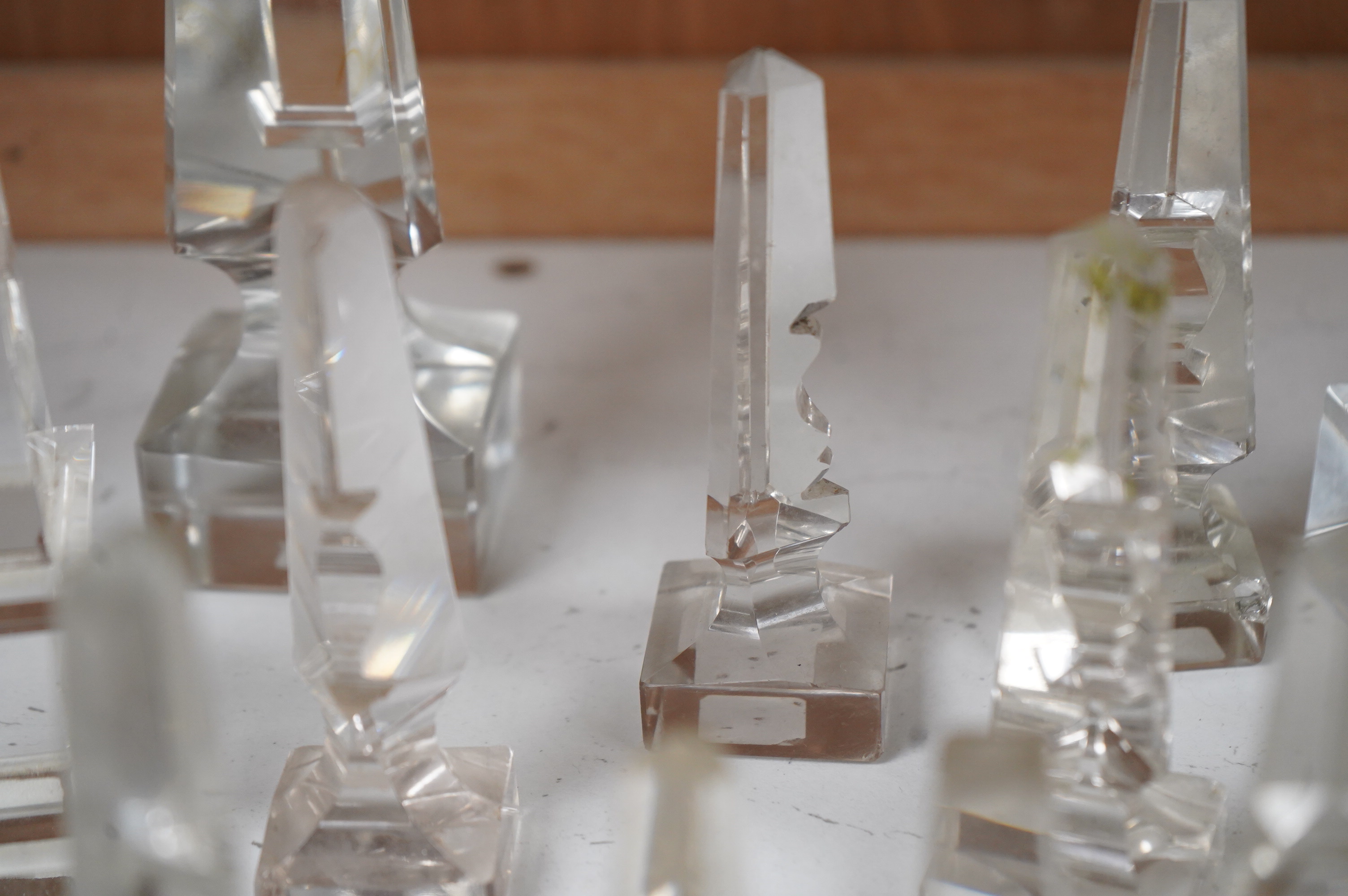 Twelve Victorian glass deceptive obelisks, and two later glass obelisk ornaments, largest pair 21cm high